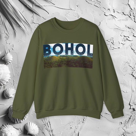 Bohol Crewneck Sweatshirt | Modern Filipino Clothing | HINIRANG. Discover the Bohol graphic crewneck by HINIRANG. This modern, stylish Filipino clothing brand’s heavy blend crewneck combines comfort with a unique design, perfect for any casual outfit. Elevate your wardrobe with this standout piece.